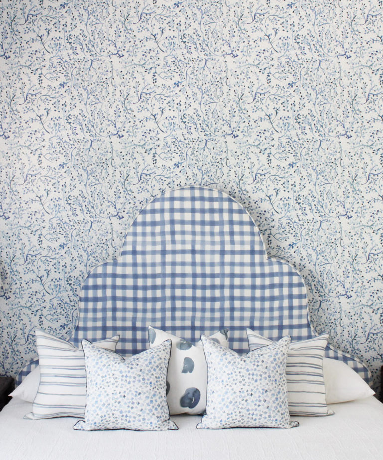 Indigo Garden • Blue Botanical Wallpaper • Floral • Bedroom with plaid blue headboard and white pillows. Milton & King UK