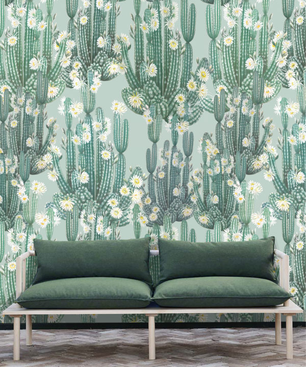 San Pedro Wallpaper Aqua • Cactus Wallpaper • Succulents Wallpaper • Desert Wallpaper Insitu behind sofa with green cushions